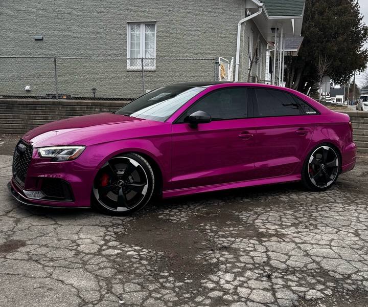 Audi RS3 sedan in a gloss magenta vinyl wrap by KAMO Tints, Laval
