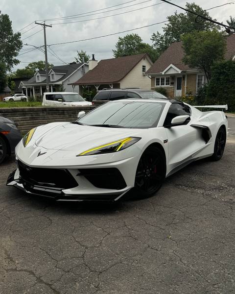 White Corvette C8 with smoked headlight film